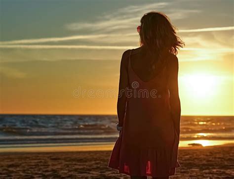Woman Looking Out To Sea At Sunset Stock Photo Image Of Horizon