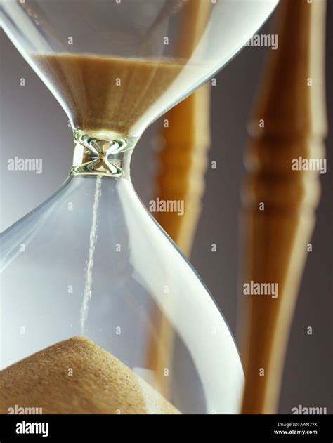 Sand Running Through Hourglass Stock Photo Alamy
