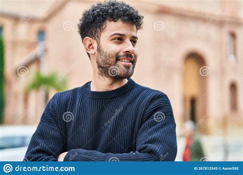 Young Arab Man Smiling Confident Standing With Arms Crossed Gesture At