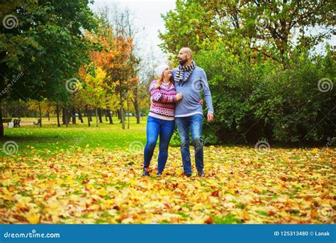 Happy Young Couple In The Autumn Park Stock Photo Image Of Plusssize
