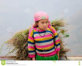 a-hmong-girl-carrying-grass-on-the-rural-road-at-sapa-town,-northern