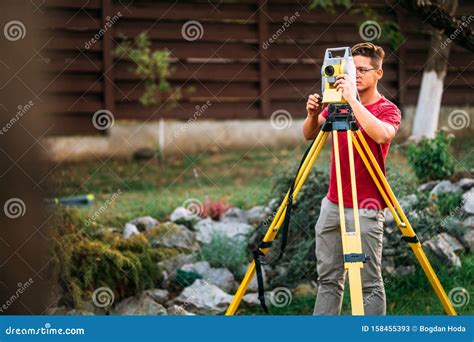Landscaping Surveyor Engineer Working On Ground Elevation Stock Image