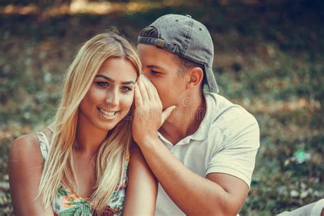 Beautiful Loving Couple Flirting In The Park On A Sunny Day Stock Image