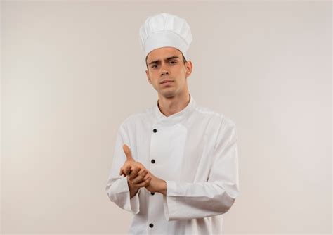 Free Photo Strict Young Male Cook Wearing Chef Uniform Showing Handshake Gesture