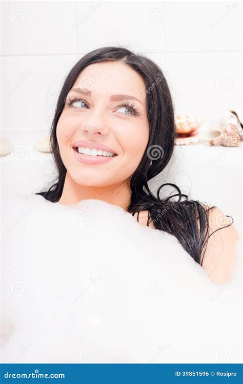 Seductive Young Brunette Blue Eyes Woman Lying Relaxing In The Bath With Foam Happy Smiling