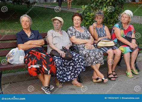 Older Women Are Sitting On A Bench In A Park Editorial Photo Image Of