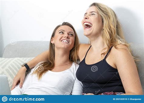 Couple Lesbian Girls On The Sofa Happy And Laughing Stock Photo Image
