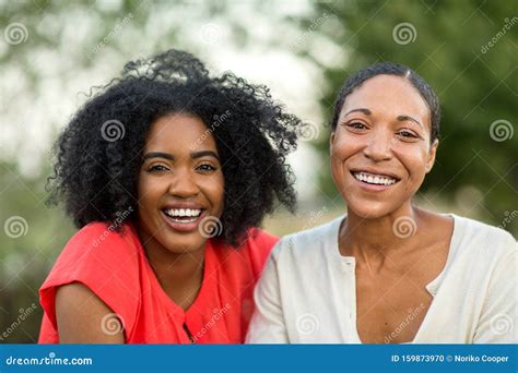 African American Mother Hugging Her Adult Daughter Stock Photo Image