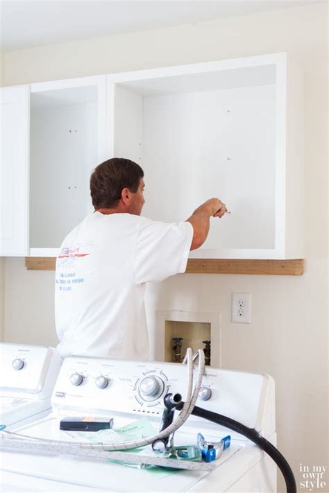 You will care about the look and feel of your laundry room, installing laundry room cabinets can help to increase the aesthetic appeal and feel of the laundry room. Mudroom Update: Installing Wall Cabinets | Laundry room ...