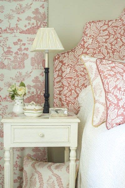 Feminine bedroom interior with a double bed with dotted sheets, armchair, art collection and plants. Fabric Gallery | Feminine bedroom, Designer wallpaper uk ...
