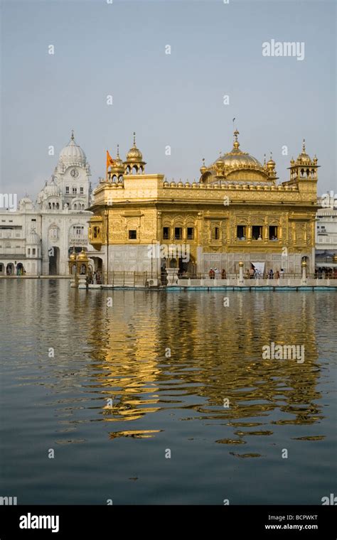 Water Of The Sarovar Water Tank Reflecting The Golden Temple Sri