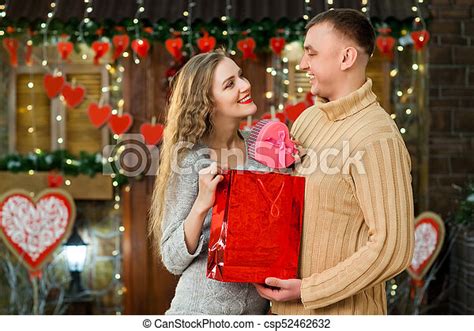 man making surprise to his woman on valentine s day couple in love celebrate valentine s day