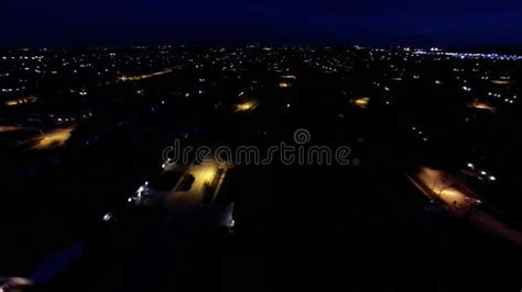 Aerial Night View Of Residential Suburban Neighborhood With Street