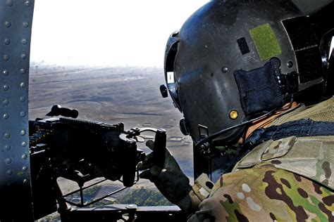 Door Gunner Us Army Spc Christopher Pond Scans His Airspace From The