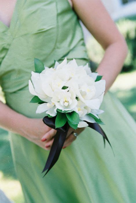 A Clean And Simple Bridesmaid Bouquet Of White Cymbidium Orchids With A