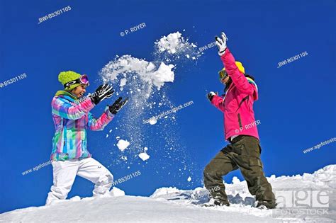 Two Children Having A Snowball Fight France Stock Photo Picture And