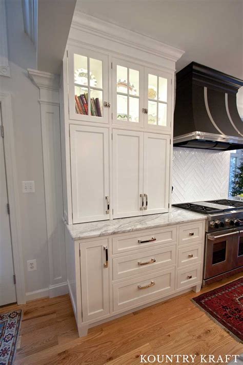 Pack a punch with freshly painted kitchen cabinets. White and Black Kitchen Cabinets for a home located in ...