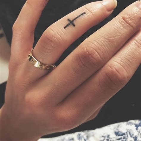 Cross Finger Tattoo