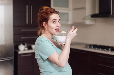 Premium Photo Beautiful Pregnant Woman Eating Cereals