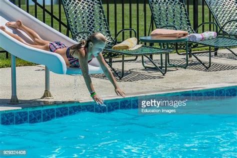 Young Girl Sliding Down A Pool Slide Photo Dactualité Getty Images