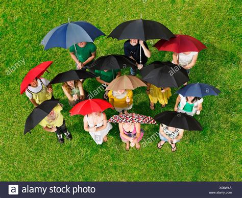 People Holding Umbrellas Stock Photos And People Holding Umbrellas Stock