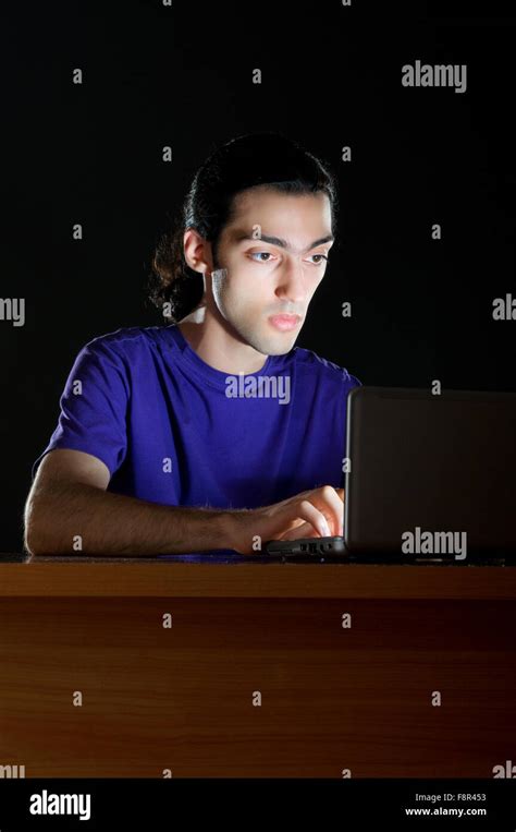 Hacker Sitting In Dark Room Stock Photo Alamy