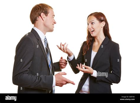 Two Business People Talking Engaged To Each Other And Using Their Stock
