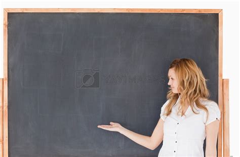 Cute Female Teacher Showing An Empty Chalkboard By Wavebreakmedia Vectors Illustrations With