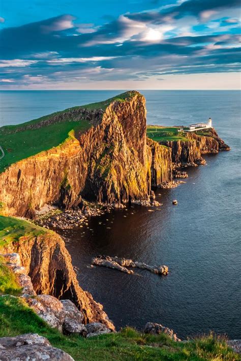 Cruise Along Scotlands Rugged Coast And Past The Welcoming Light Of
