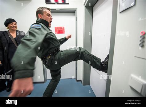 A Police Officer Demonstrates How To Kick In A Door In The Line Of Duty
