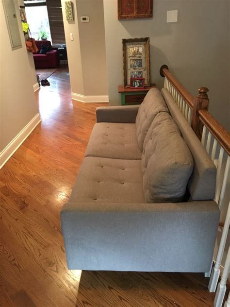 In business since 1982, we sell beautiful, heirloom quality, real wood furniture. Grey couch, wooden legs. Just under 6 feet long. Located ...