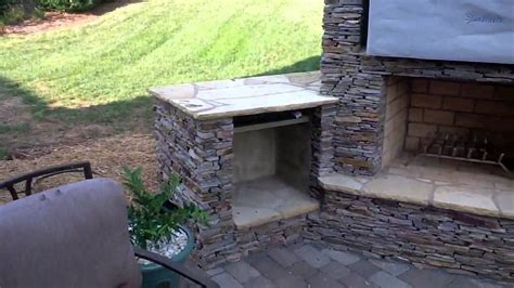 Stack Stone Outdoor Fireplace And Outdoor Kitchen With