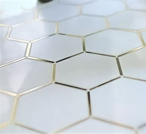 This Might Be The Ultimate For Hexes Gold Trimmed White Hexagon Tile