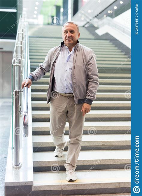 Middle Aged Man Going Down Stairs In Mall Stock Photo Image Of City