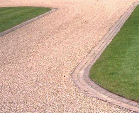 A gravel driveway is composed of loose aggregate with borders of concrete, wood or another material to keep the driveway contained. Home - Landscape Knowledge | Circle driveway, Brick ...