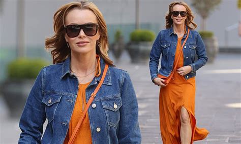 amanda holden is a vision in orange as she flashes her legs in bold