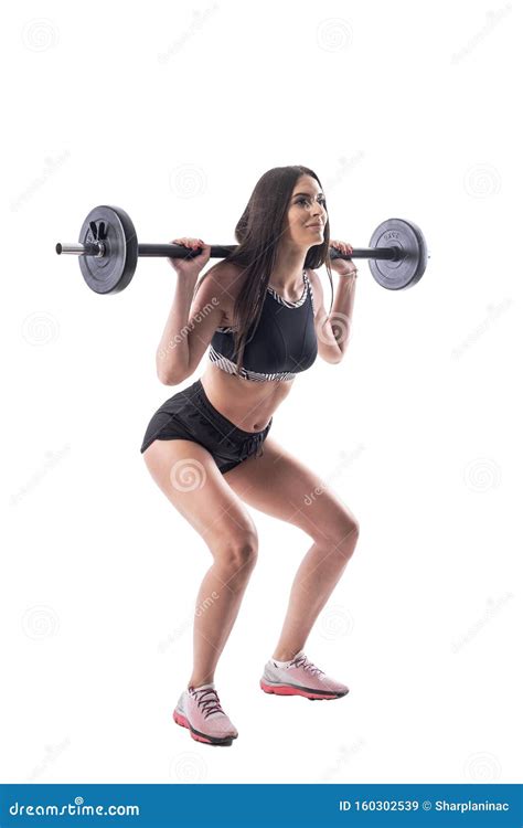 Side View Of Attractive Athletic Gym Woman Doing Squat Exercises With
