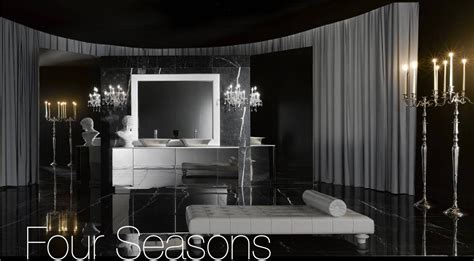 Small tub in simple bathroom with wooden flooring. Fashion & Life Style: Luxury Bathroom Design