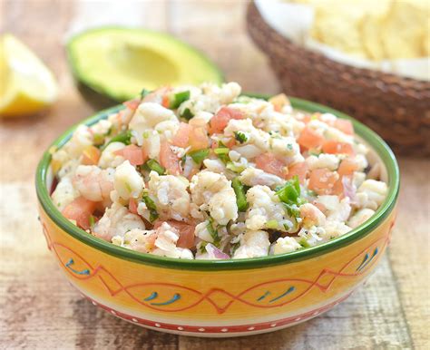 This shrimp ceviche is made with limes, lemon, red onion, cucumber, chile peppers, cilantro, and avocado. Homemade Summer Shrimp Ceviche Recipe | Onion Rings & Things