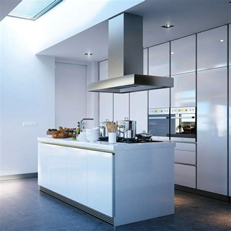 Vous benéficiez d'un plan de travail supplémentaire. cuisine moderne plaques de cuisson îlot central hotte ...