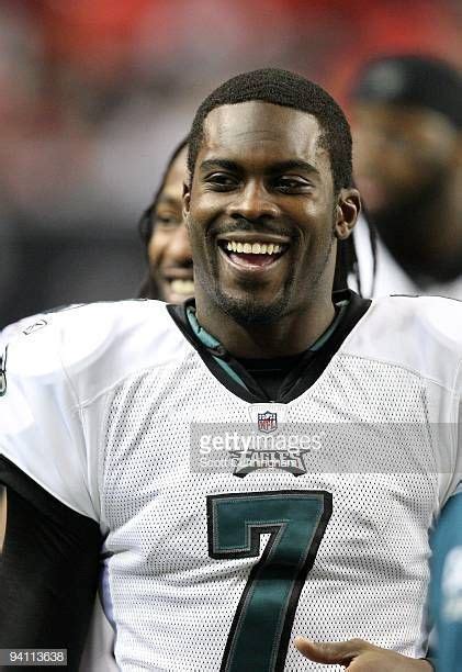 Michael Vick Of The Philadelphia Eagles Relaxes On The Bench Late In