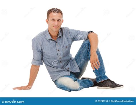 A Handsome Young Man Sitting On The Floor Stock Image Image Of Jeans