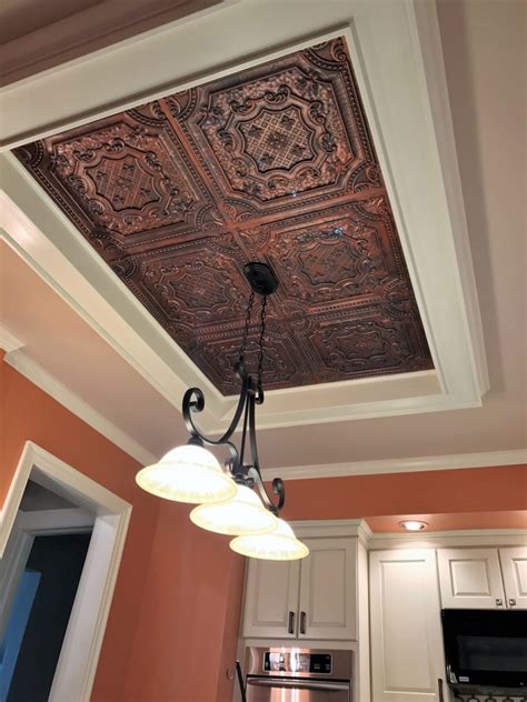 The redesign of this kitchen included hiding the ugly popcorn material previously visible first thing when entering the room. Elizabethan Shield - Faux Tin Ceiling Tile - 24″x24″ - # ...