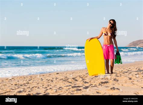 A Beautiful Girl At The Beach With Her Bodyboard Stock Photo Alamy
