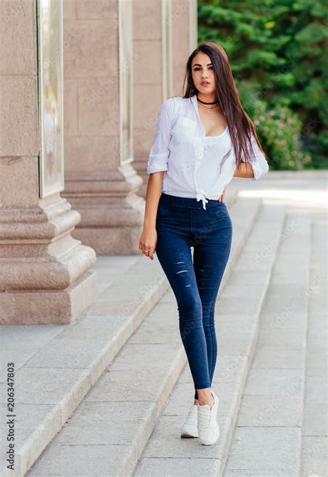 Young Sexy Stylish Girl Slim Tall Girl In Jeans And Shirt On The