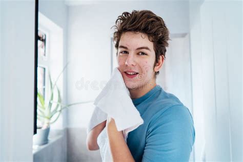 Portrait Of Smiling Teenage Boy With Acne Problem Who Takes Care His