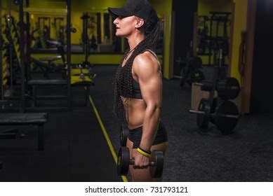 Strong Fitness Woman Bodybuilder Cap Tanned Stock Photo
