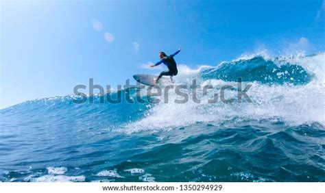 Low Angle Lens Flare Cheerful Surfer Stock Photo Edit Now 1350294929