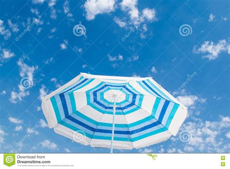 Striped Beach Umbrella Under Blue Sky Stock Photo Image Of Activity