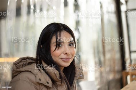 Portrait Of Young Black Haired Woman She Is Sitting On The Coffee Shop